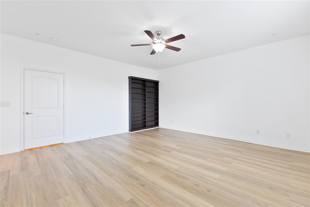 122 Southwest 7th Court, Unit 122 Pompano Beach, FL 33060 - Photo 4 of 36 a view of an empty room with wooden floor