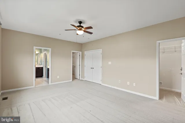 a view of an empty room with a bathroom
