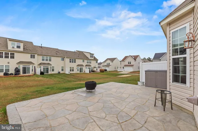 a view of house with yard outdoor seating area and barbeque oven