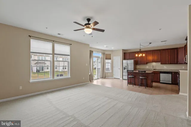 a large bedroom with furniture and a window
