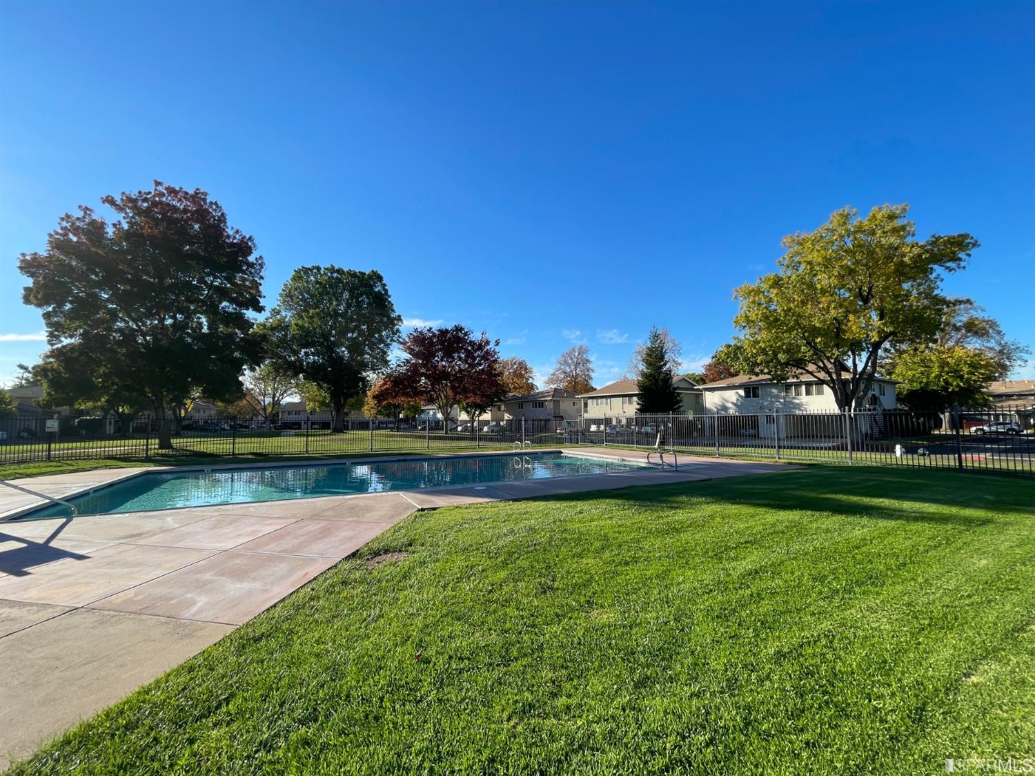 1493 Del Rio Circle, Unit D Concord, CA 94518 - Photo 23 of 23 a view of a swimming pool with a yard and a fountain