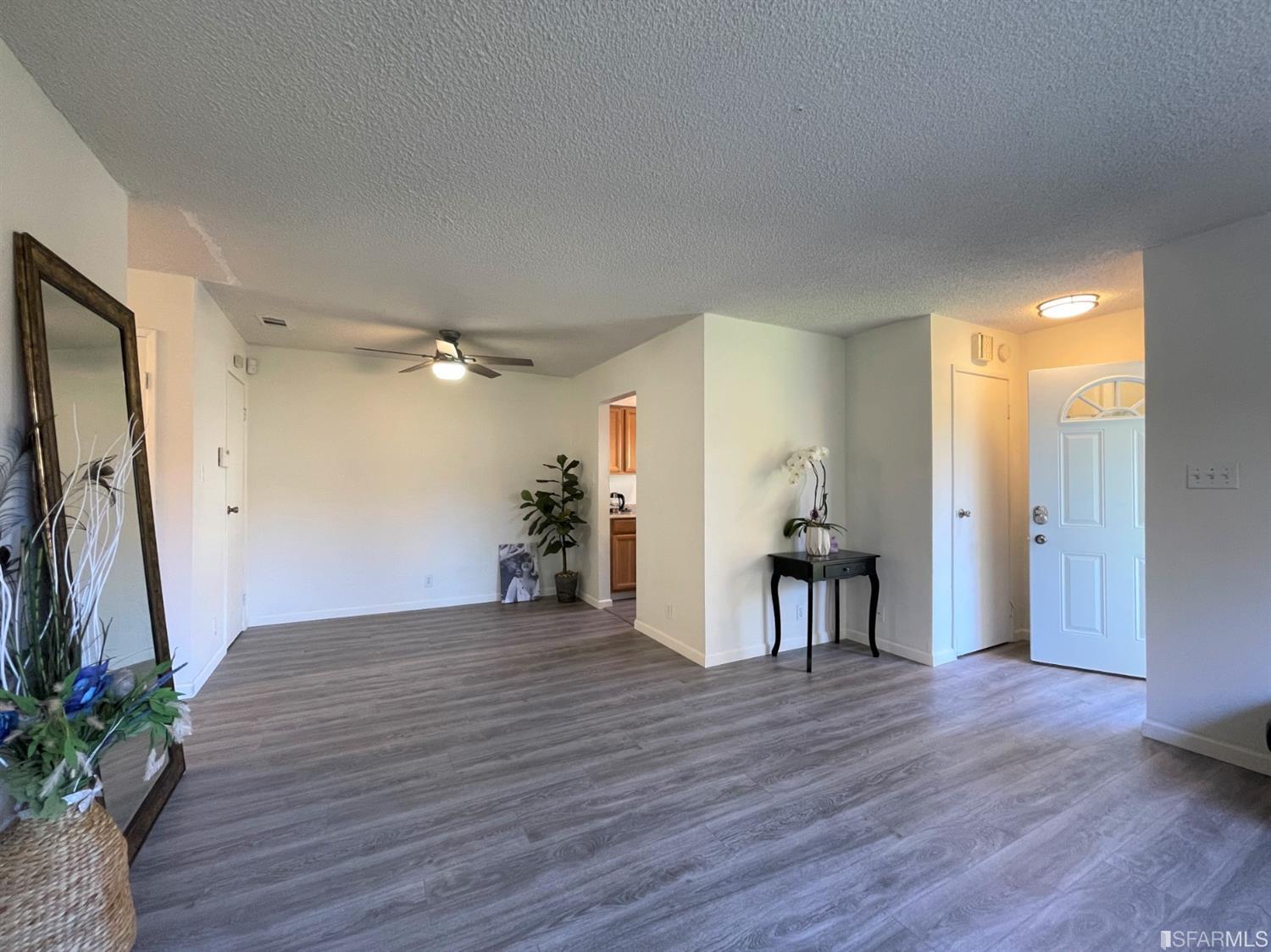 1493 Del Rio Circle, Unit D Concord, CA 94518 - Photo 5 of 23 a view of empty room with wooden floor