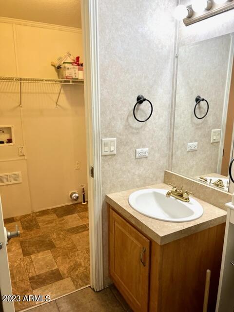 701 South Dobson Road, Unit 4 Mesa, AZ 85202 - Photo 12 of 37 VANITY LIGHTING AND VIEW TO LAUNDRY AREA