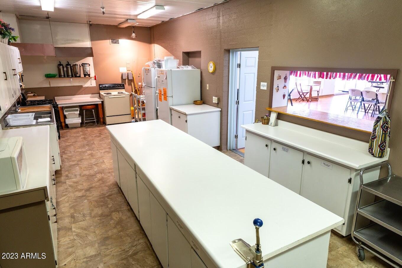 701 South Dobson Road, Unit 4 Mesa, AZ 85202 - Photo 32 of 37 HOLIDAY VILLAGE COMMUNITY KITCHEN AREA