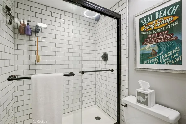 a bathroom with a shower and a sink