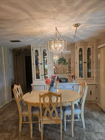 a bedroom with a bed and a mirror