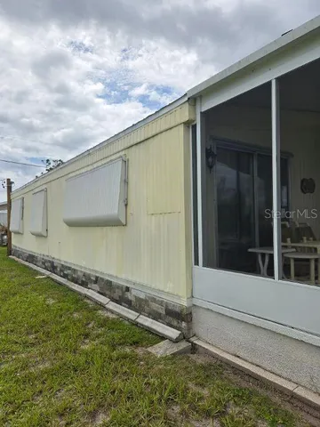a view of a backyard of the house