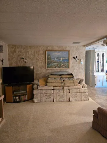 a kitchen with a refrigerator a oven and a sink