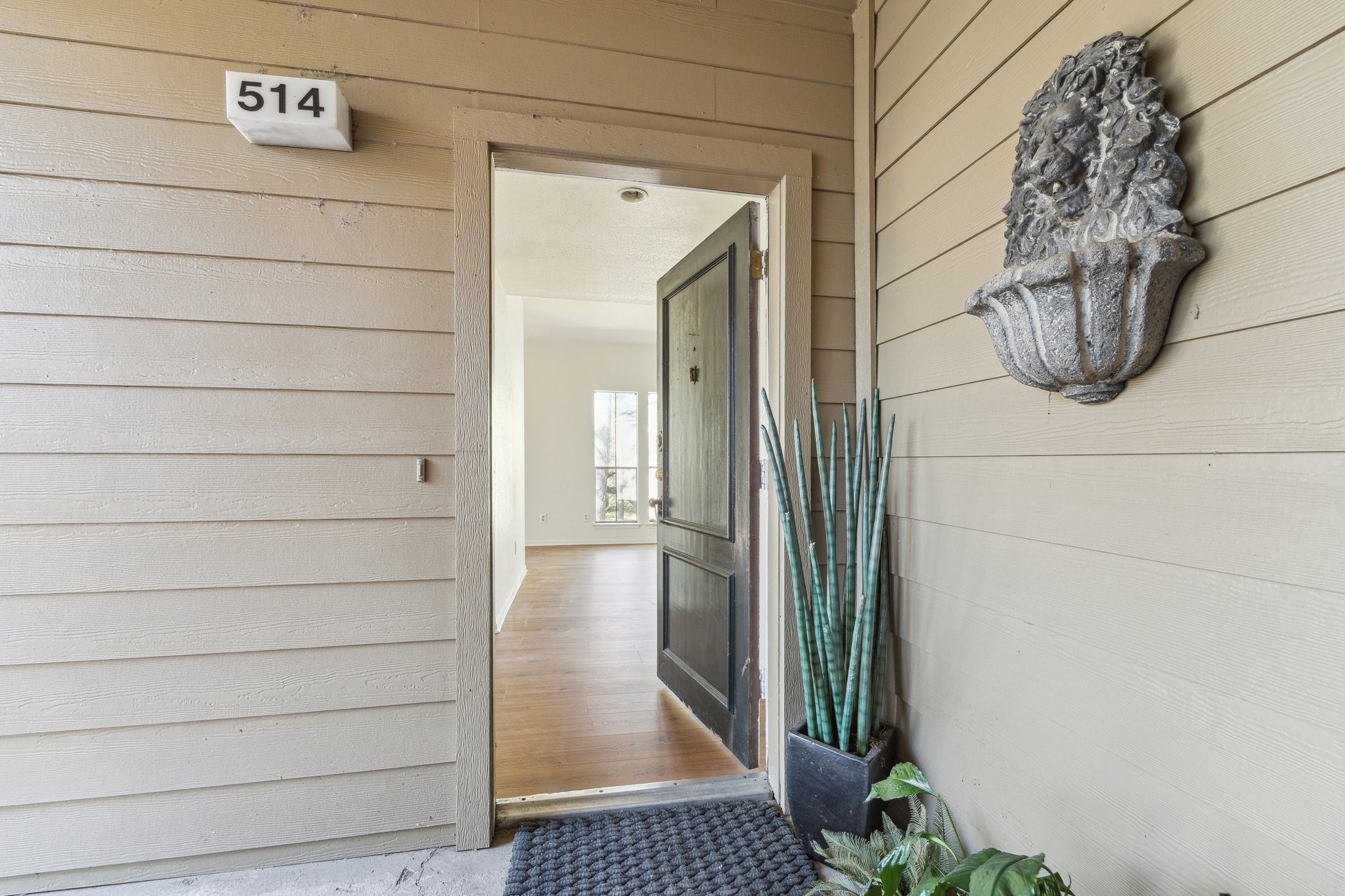 2100 Tanglewilde Street, Unit 514 Houston, TX 77063 - Photo 3 of 22 a view of a door and wooden floor