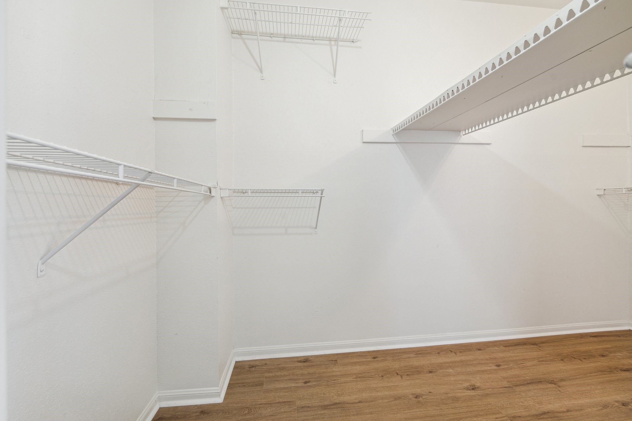 2100 Tanglewilde Street, Unit 514 Houston, TX 77063 - Photo 8 of 22 a view of small space with racks on the wall