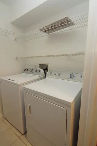 a utility room with dryer and washer