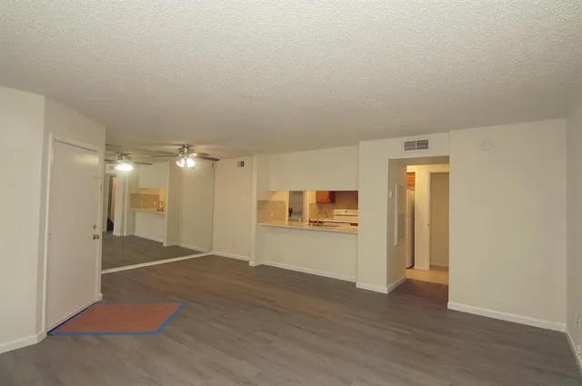 a view of a livingroom with wooden floor