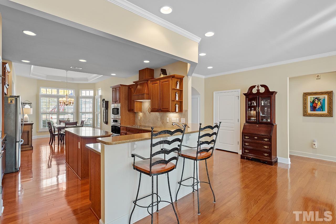 113 Beckingham Loop Cary, NC 27519 - Photo 18 of 46 a view of a dining room with furniture and wooden floor