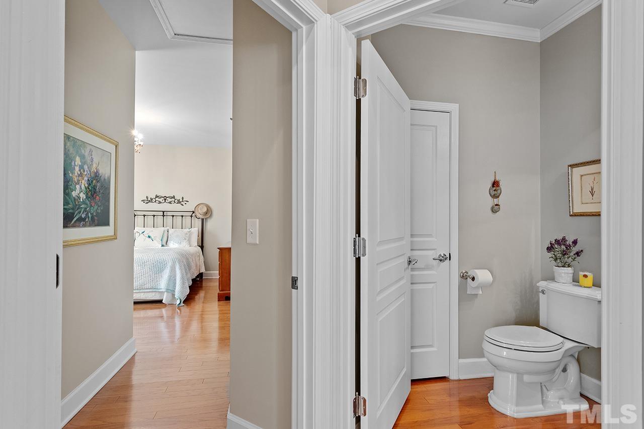 113 Beckingham Loop Cary, NC 27519 - Photo 30 of 46 a bathroom with a toilet and a shower