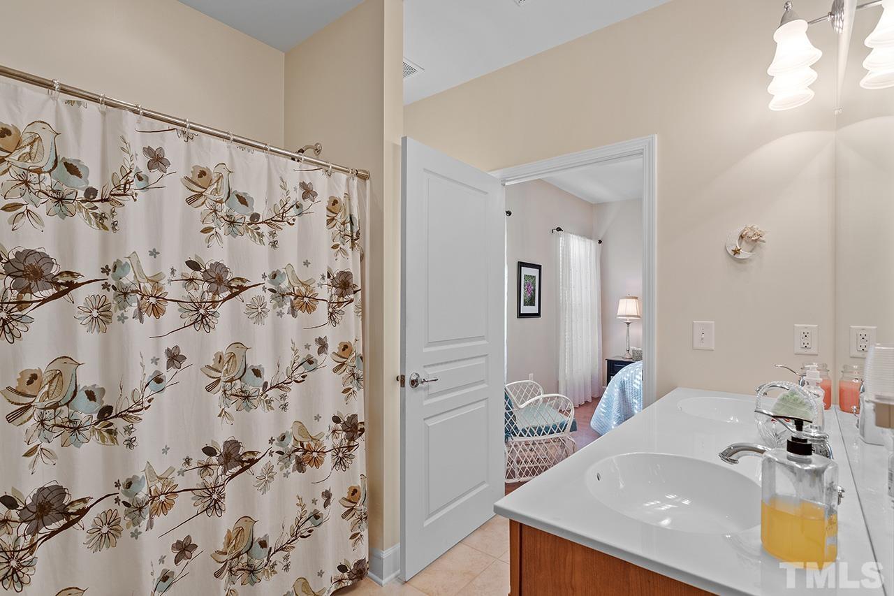113 Beckingham Loop Cary, NC 27519 - Photo 33 of 46 a bathroom with a sink and a mirror
