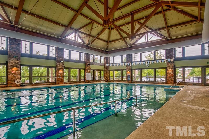 113 Beckingham Loop Cary, NC 27519 - Photo 41 of 46 a view of a large building next to a lake