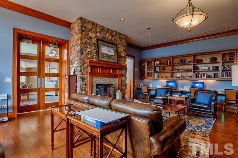 113 Beckingham Loop Cary, NC 27519 - Photo 46 of 46 a living room with fireplace furniture and a large window