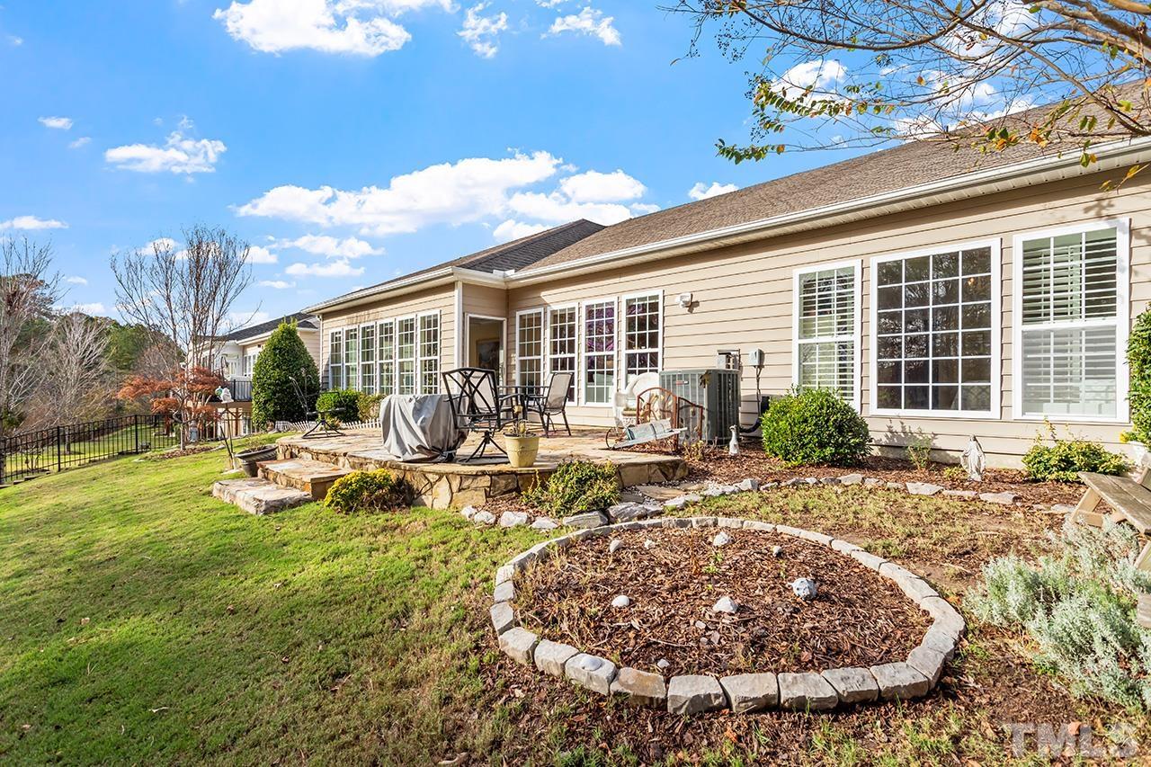 113 Beckingham Loop Cary, NC 27519 - Photo 7 of 46 a view of a house with backyard sitting area and garden