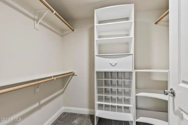 a bedroom with bed and window