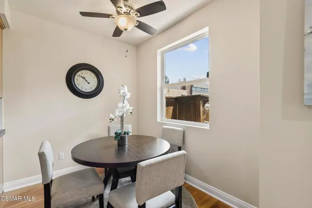 a dining room with table and chairs