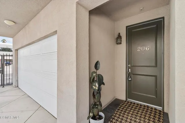 a view of a closet area with wooden floor