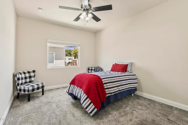 a living room with furniture a table and wooden floor