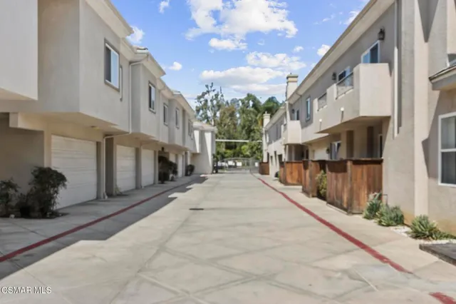 a view of a street with brick building