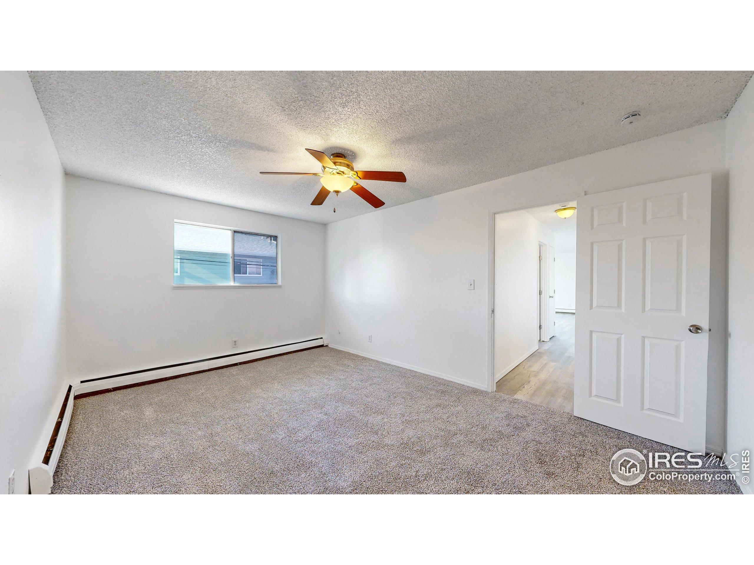 6975 Mariposa Street Denver, CO 80221 - Photo 18 of 34 a open living room with a couch