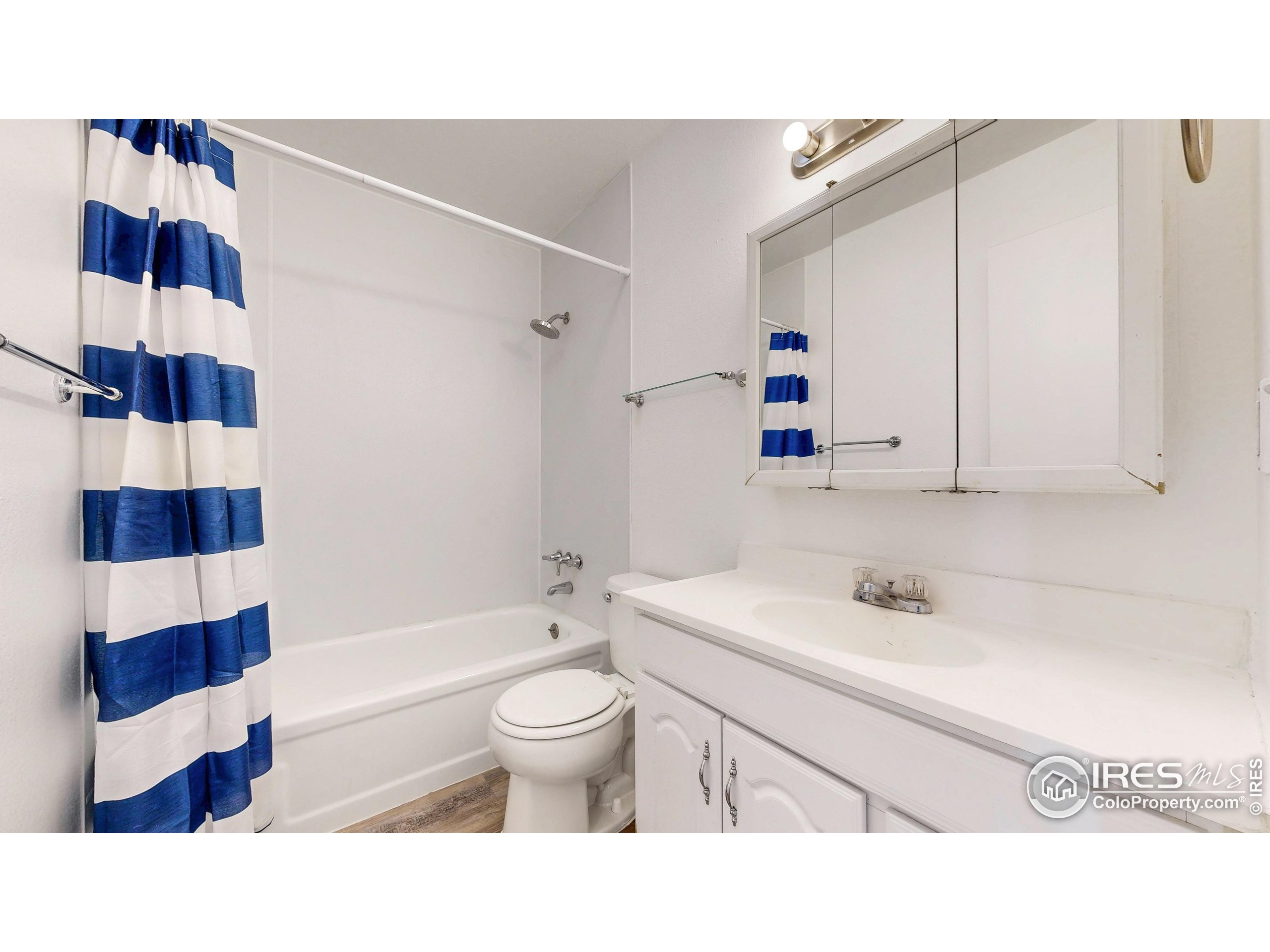 6975 Mariposa Street Denver, CO 80221 - Photo 24 of 34 a bathroom with a sink toilet a shower and bathtub