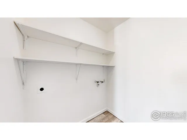 a open living room with a wooden floor