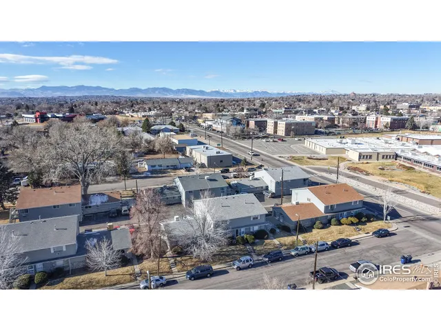 a balcony with a table and chairs