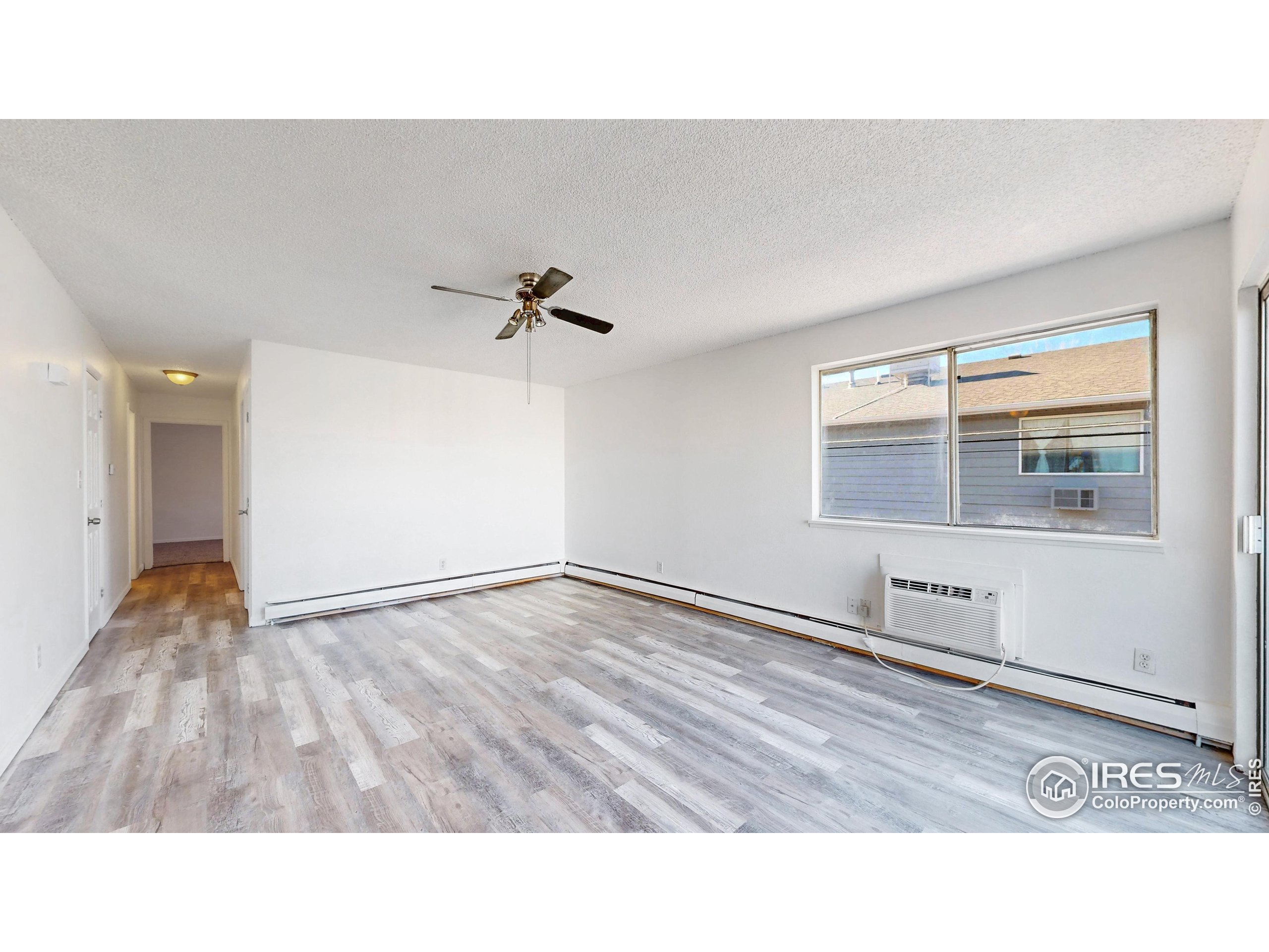 6975 Mariposa Street Denver, CO 80221 - Photo 4 of 34 a black and white photo of a room
