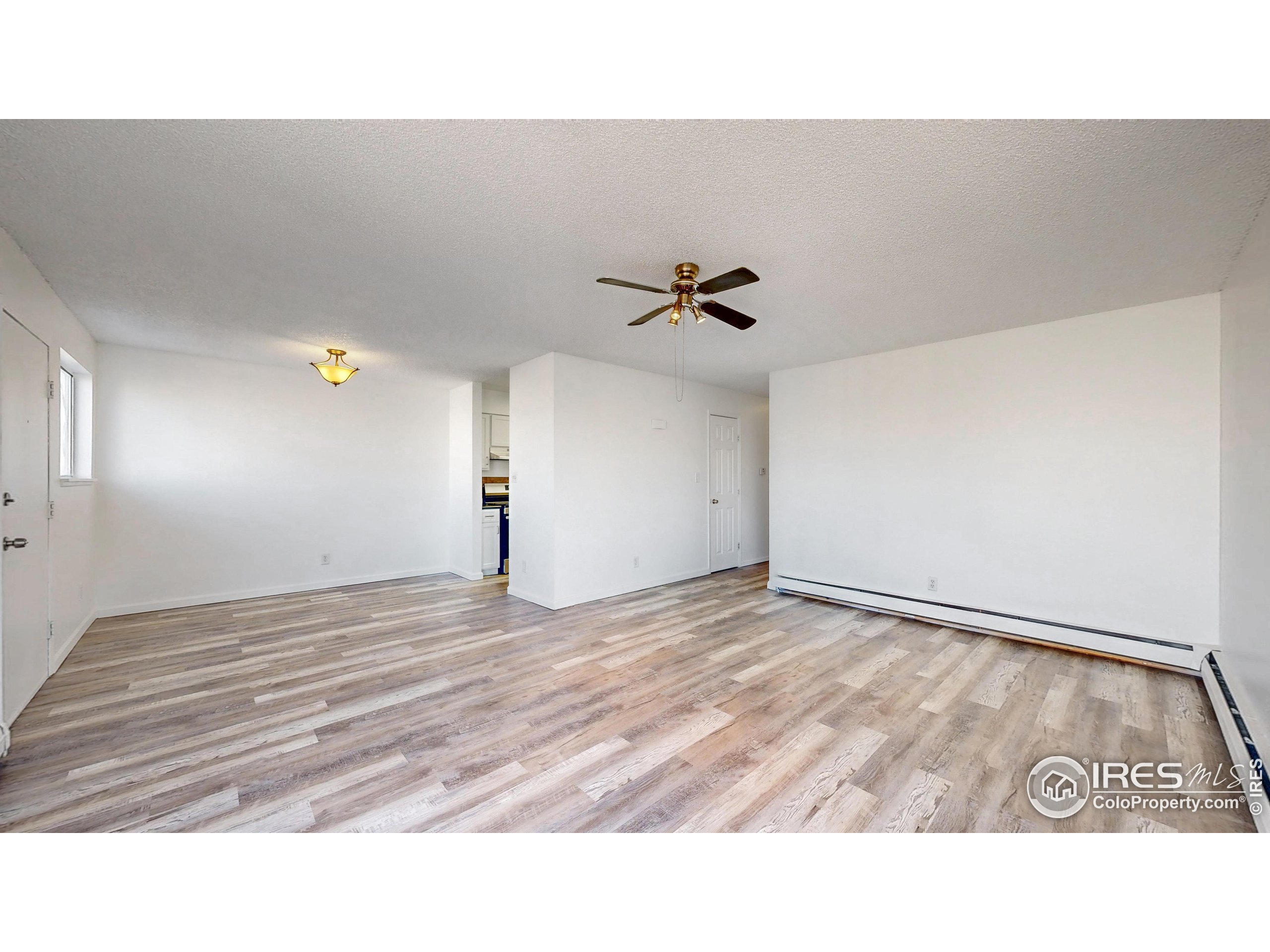 6975 Mariposa Street Denver, CO 80221 - Photo 6 of 34 a view of an empty room