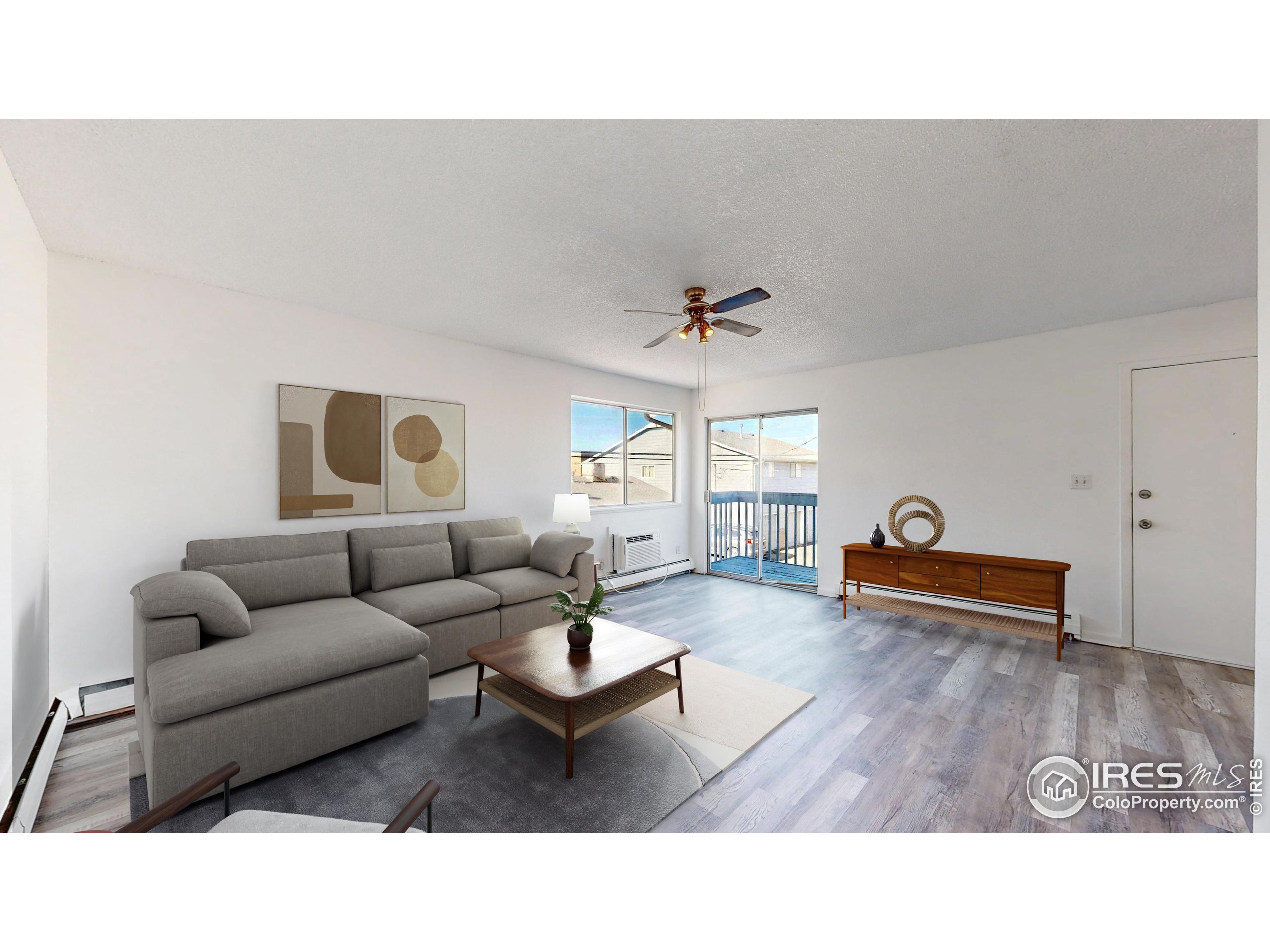6975 Mariposa Street Denver, CO 80221 - Photo 8 of 34 a living room with furniture and a table