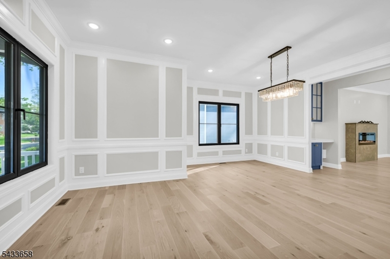 2 Orchard Road Florham Park, NJ 07932 - Photo 7 of 23 a view of an empty room with a window and wooden floor