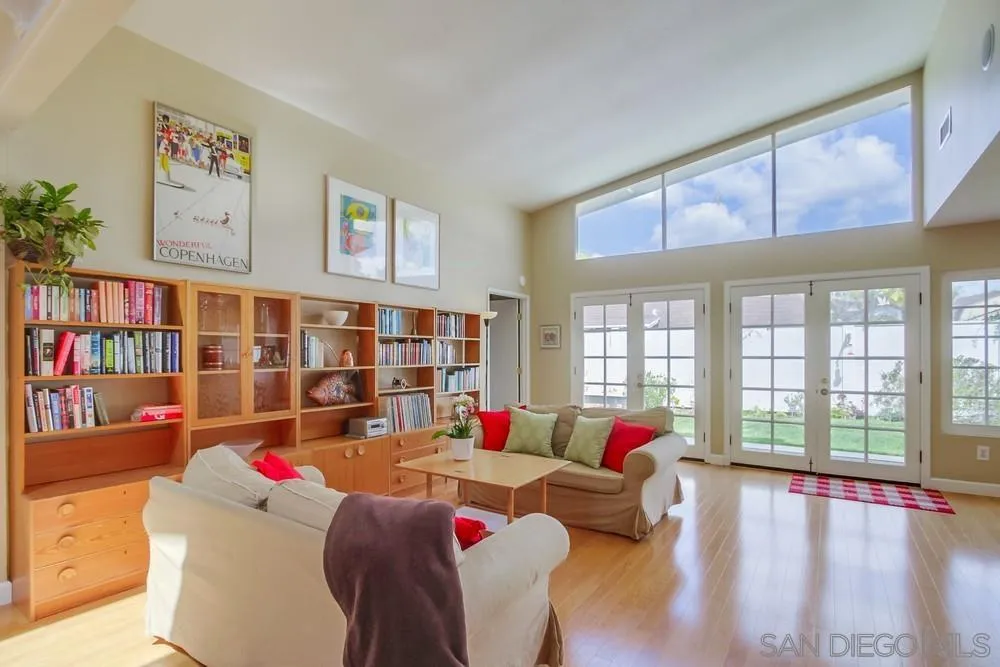 13202 Lingre Avenue Poway, CA 92064 - Photo 15 of 71 a living room filled with furniture and a floor to ceiling window