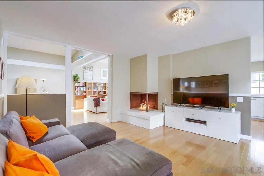 13202 Lingre Avenue Poway, CA 92064 - Photo 20 of 71 a living room with furniture and a flat screen tv