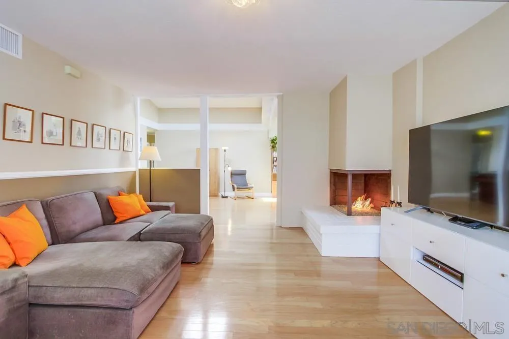 13202 Lingre Avenue Poway, CA 92064 - Photo 21 of 71 a living room with furniture and a flat screen tv