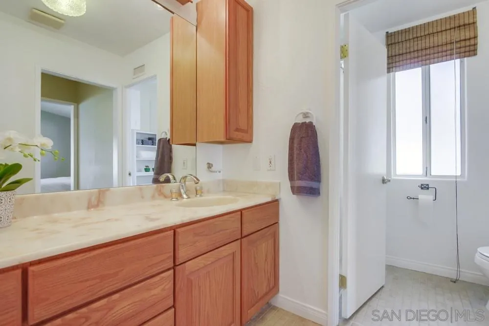 13202 Lingre Avenue Poway, CA 92064 - Photo 42 of 71 a bathroom with a sink and a mirror