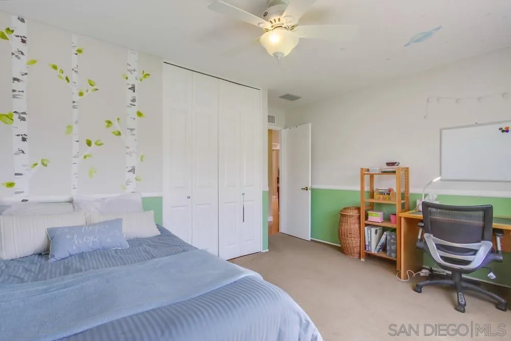 13202 Lingre Avenue Poway, CA 92064 - Photo 49 of 71 a bedroom with a bed and a chandelier