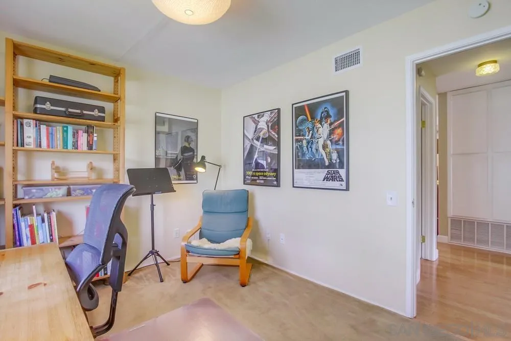 13202 Lingre Avenue Poway, CA 92064 - Photo 55 of 71 a living room with furniture and a book shelf