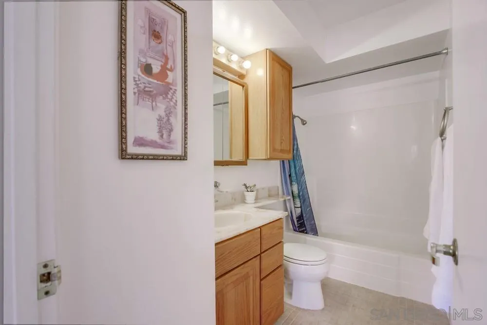 13202 Lingre Avenue Poway, CA 92064 - Photo 56 of 71 a bathroom with a toilet sink and mirror