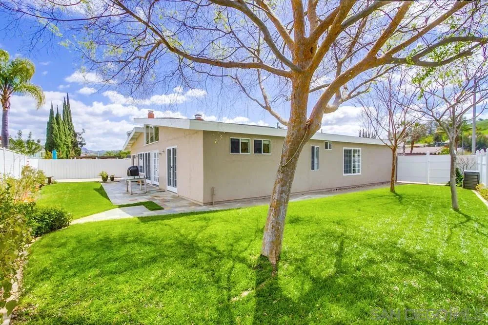13202 Lingre Avenue Poway, CA 92064 - Photo 65 of 71 a white house with a large tree and a yard