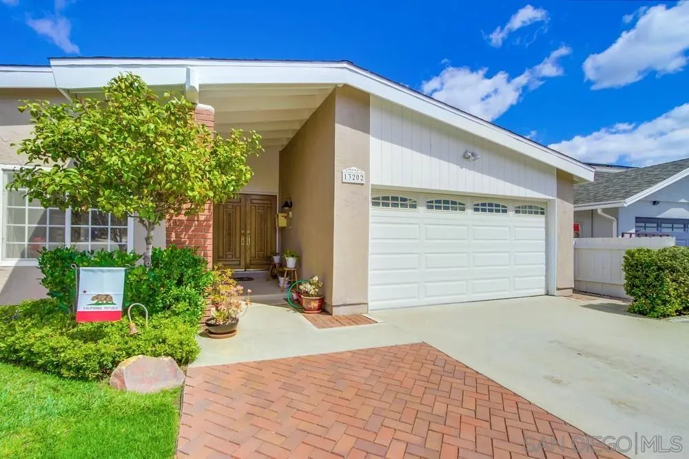 13202 Lingre Avenue Poway, CA 92064 - Photo 7 of 71 a front view of a house with a yard and garage