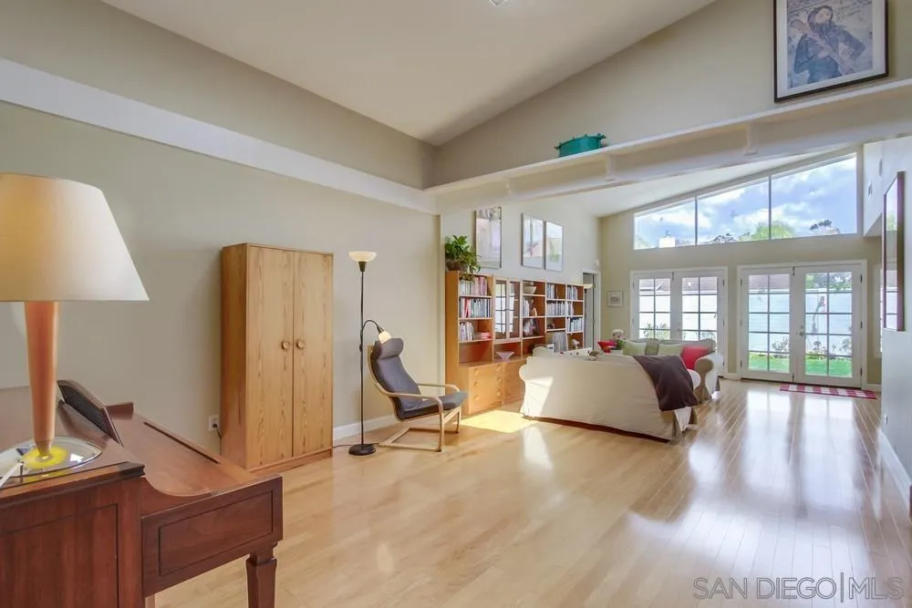 13202 Lingre Avenue Poway, CA 92064 - Photo 10 of 71 a living room with furniture gym equipment and a large window