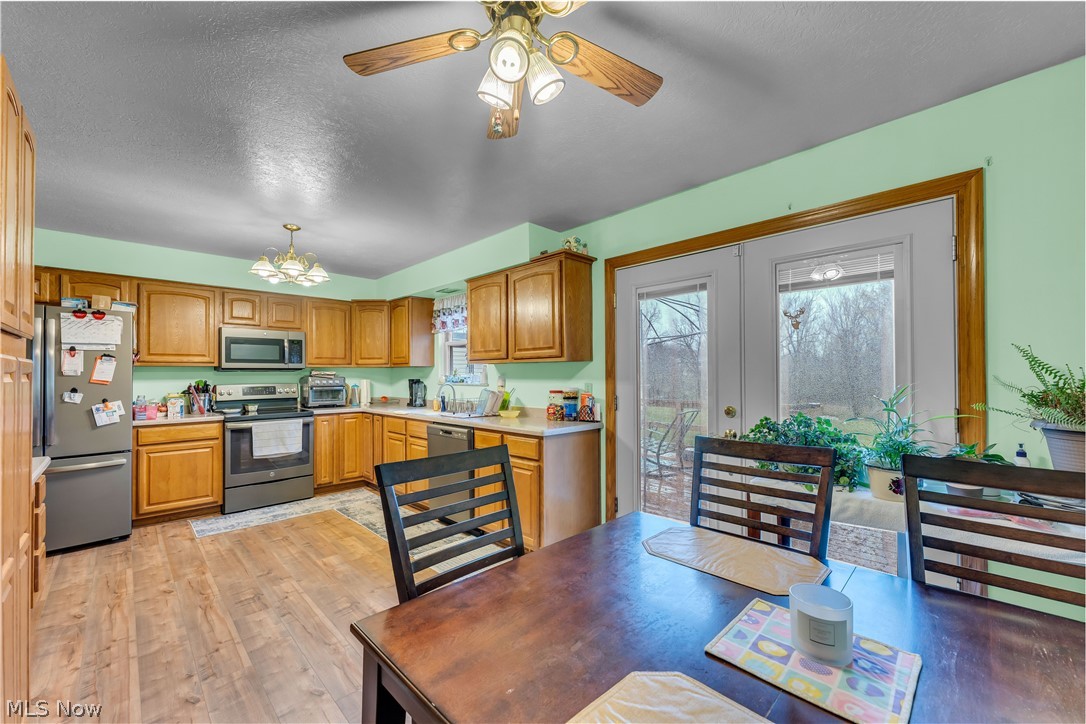 9642 Crow Road Litchfield, OH 44253 - Photo 23 of 50 Bedroom with ceiling fan and light wood-type flooring