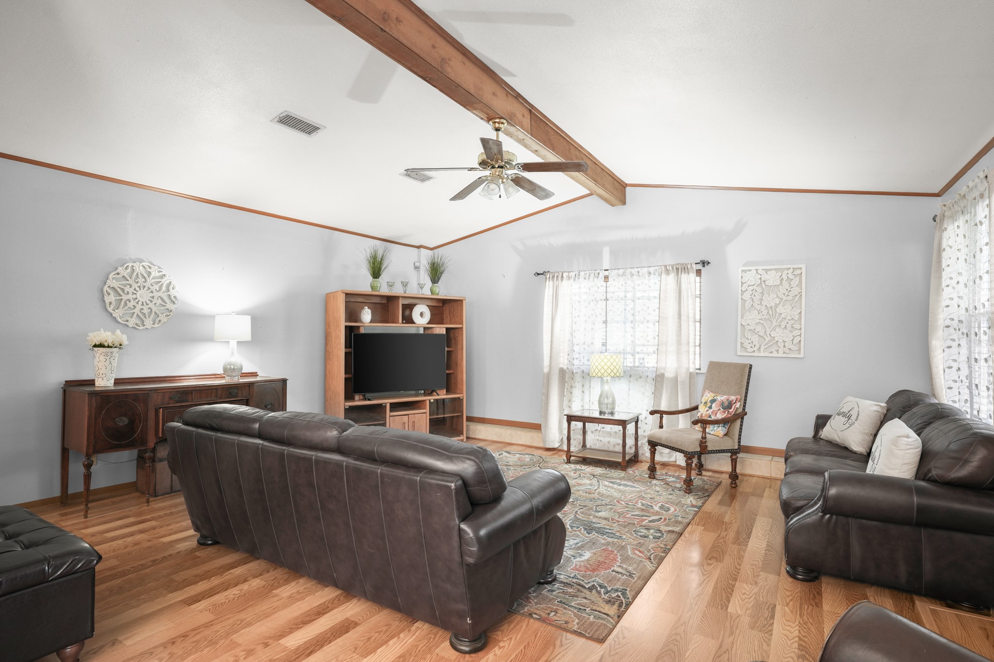 1908 Holly Street Austin, TX 78702 - Photo 4 of 22 Hardwood floors and exposed beam ceilings define this inviting living area.