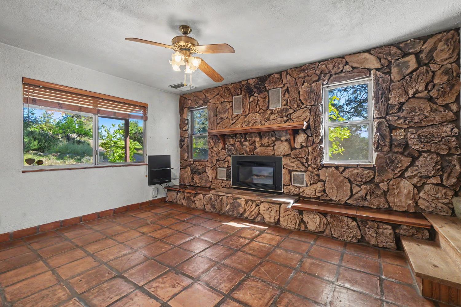 17800 Red Mule Road Fiddletown, CA 95629 - Photo 11 of 74 a living room with furniture a window and a fireplace