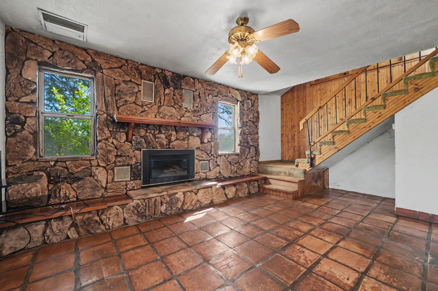 17800 Red Mule Road Fiddletown, CA 95629 - Photo 12 of 74 a living room with furniture and a fireplace