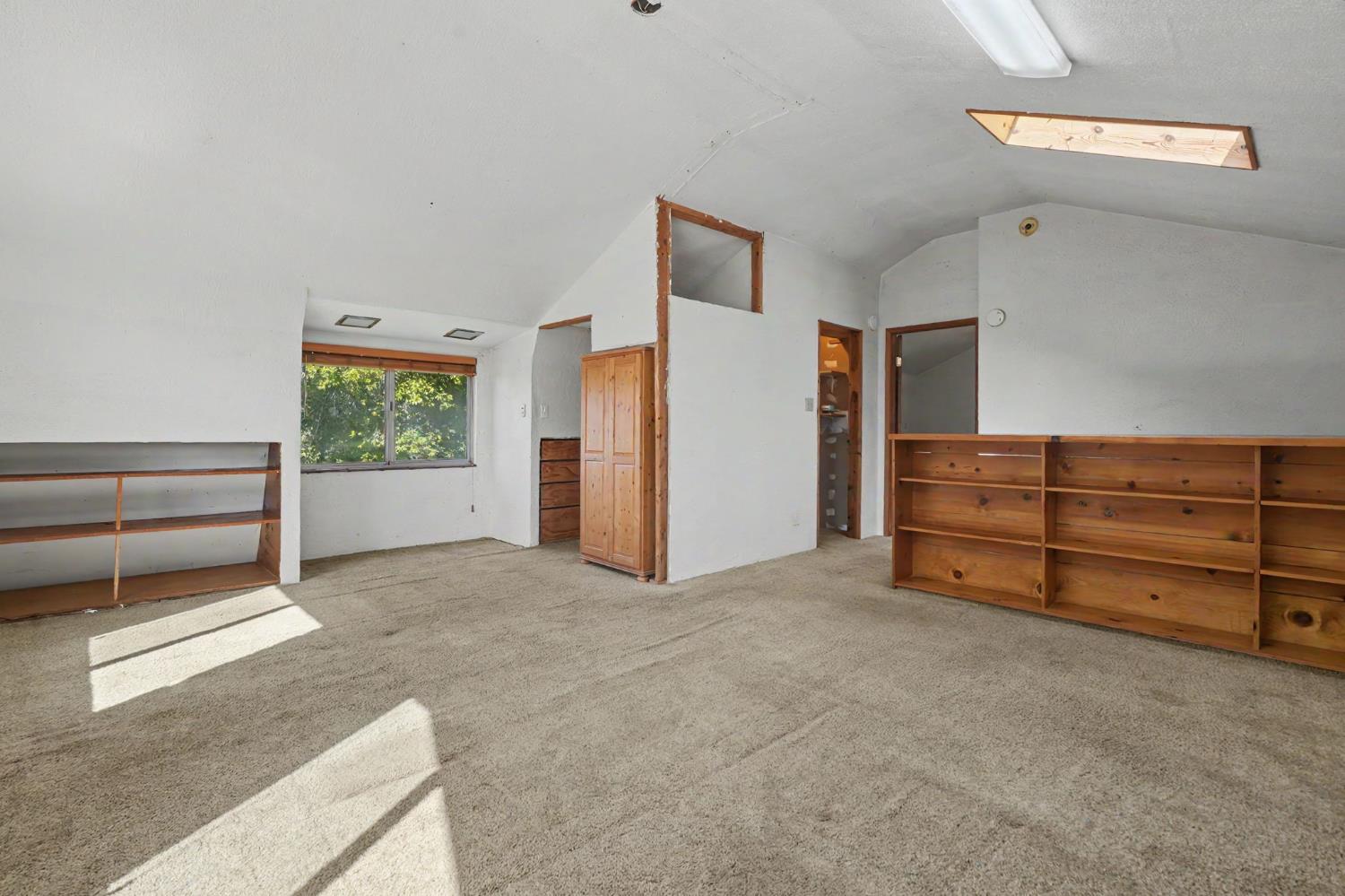 17800 Red Mule Road Fiddletown, CA 95629 - Photo 25 of 74 a view of an empty room with a cabinet and a window